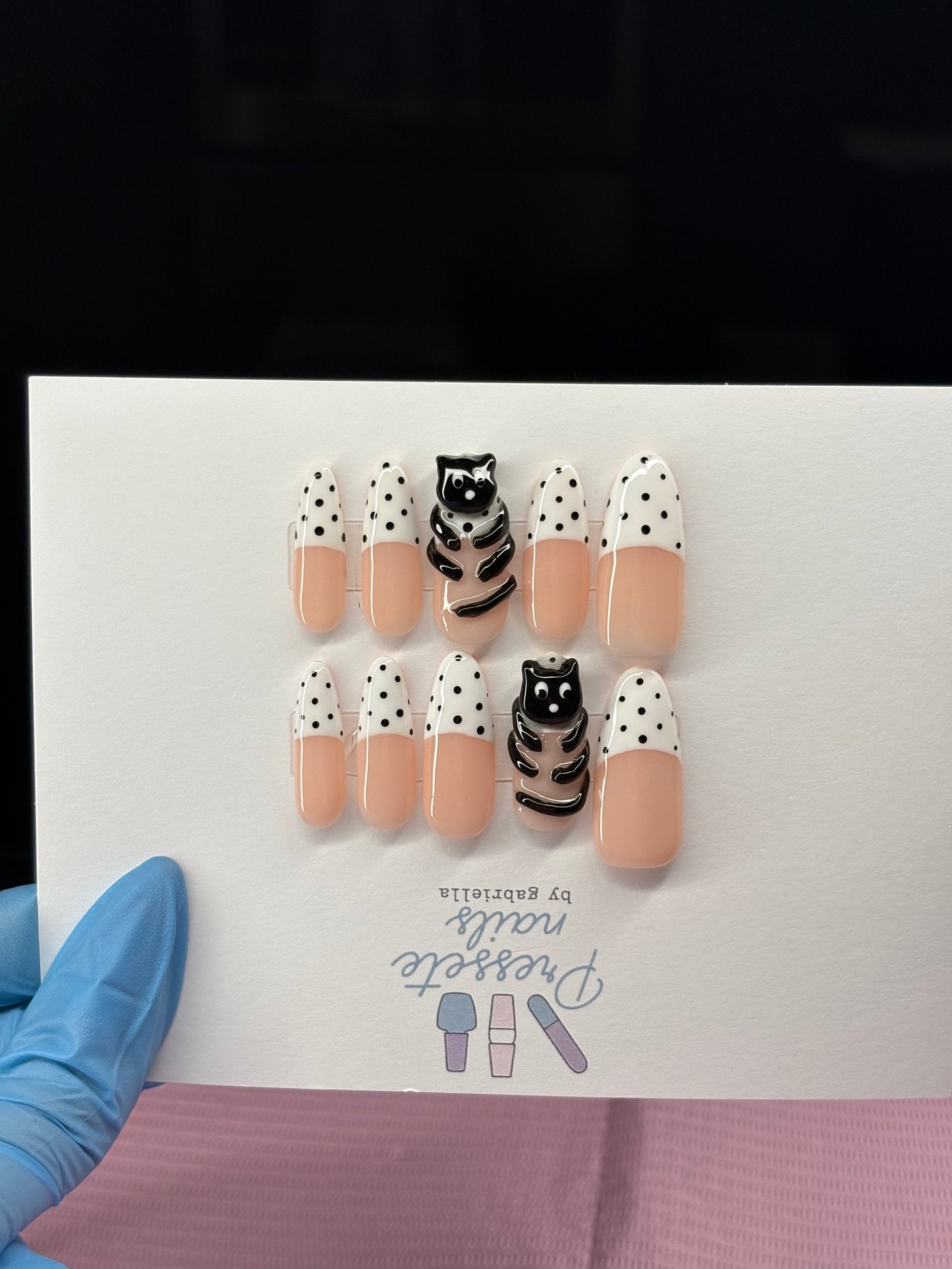 Black cat with polka dots