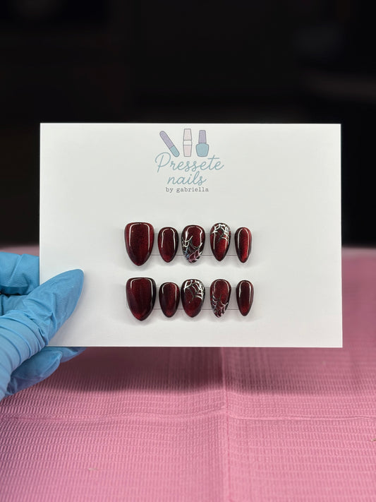 Red cat eye with spider webs